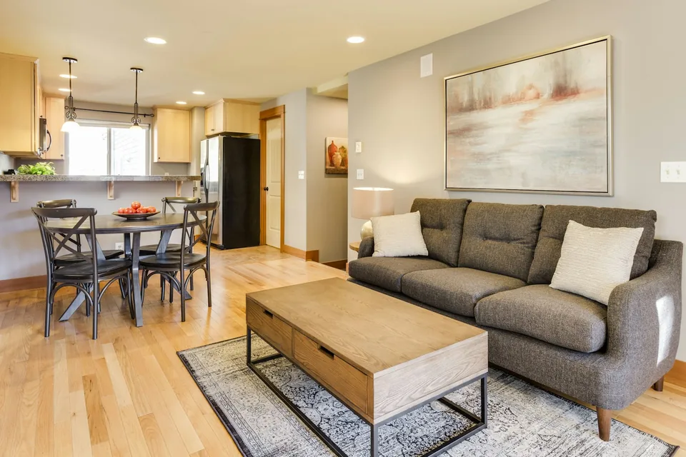 Bright, spotless residential living space with warm hardwood floors